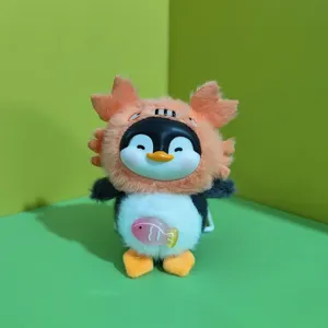 Cute penguin plush toy pendant detail showing vinyl face and fluffy monster hat design.