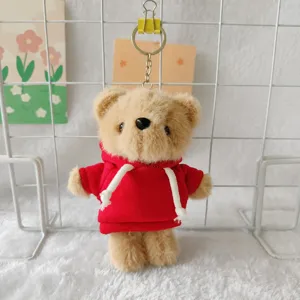 Cute plush bear keychain, fluffy animal doll pendant with red hoodie, bag decoration.