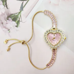 Gold rhinestone heart watch for women, pink dial and adjustable slider bracelet chain.