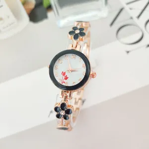 Elegant rose gold women quartz watch with black flower bracelet strap and white dial.