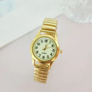 Vintage χρυσό ρολόι quartz με ελαστικό μεταλλικό λουράκι και μεγάλους αριθμούς για γυναίκες.