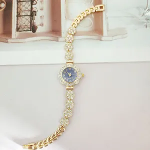 Women rhinestone quartz watch gold metal bracelet floral charm sparkling wristwatch daily elegant.