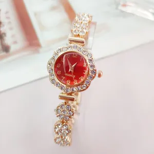 Detailed view of a stylish women rhinestone quartz watch with red dial and flower bezel.