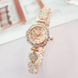 Elegant rose gold rhinestone quartz watch for women, flower shaped dial and sparkling crystal strap.