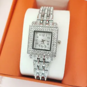 Detailed view of the women luxury square rhinestone quartz watch with sparkling crystal strap.