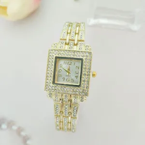 Elegant women's square quartz watch featuring sparkling rhinestones on gold tone metal band.