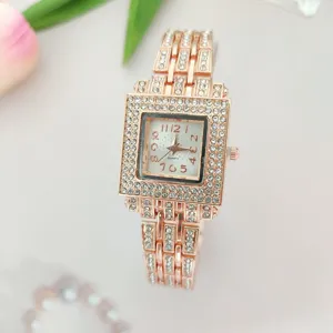 Close-up view of a luxury rose gold square rhinestone quartz women watch detail and dial.