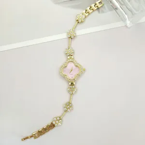 Exquisite clover shape quartz watch with rhinestones, elegant pink dial for women.