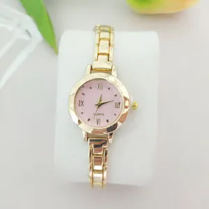 Montre quartz femme cadran rose bracelet en métal doré montre élégante de style décontracté