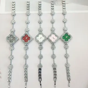 Stylish women quartz watch set with clover rhinestone design and elegant chain strap.