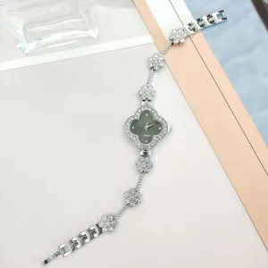 Silver quartz women watch with rhinestone clover design stylish delicate chain bracelet