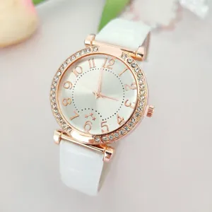 Elegant women rose gold quartz watch featuring a white leather strap and crystal rhinestone bezel