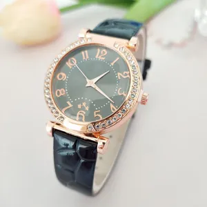Women's quartz watch with crystal bezel, dark dial and black leather strap for daily wear.