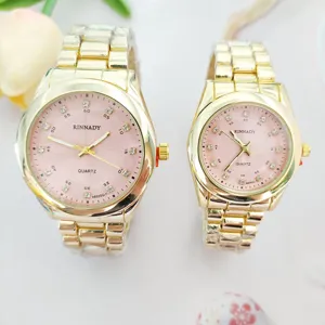 Luxury gold couple quartz watches with pink dial and sparkling diamond hour markers for lovers.