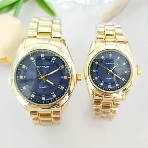 Luxury gold stainless steel couple quartz watch dial details, elegant shiny crystal markers.
