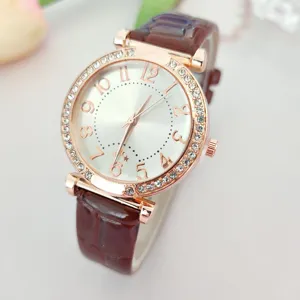 Elegant women quartz watch with rhinestone bezel and brown leather strap detailed view.