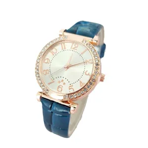 Elegant women quartz watch with rose gold diamond bezel and blue leather strap for daily wear.