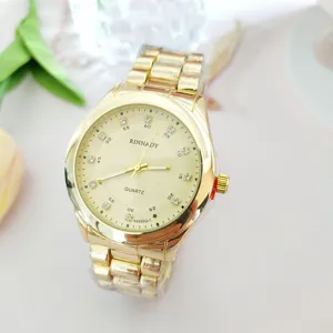 Luxury gold quartz watch for men and women, elegant rhinestone dial with steel strap.
