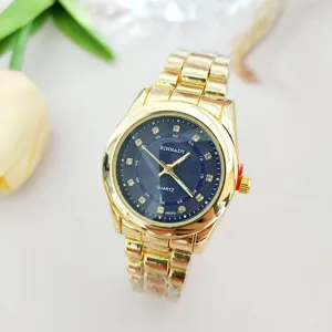 Luxury gold quartz watch for men and women with diamond dial and stainless steel strap.