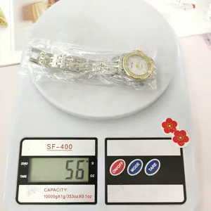 Women steel strap rhinestone quartz watch detail view, elegant ladies wristwatch accessory.