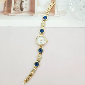 Damen Quarz Uhr gold Armband Luxus Mode Strass blaue Steine lässig Armbanduhr Schmuck