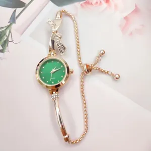 Elegant women quartz watch with green dial, rhinestone bow detail and rose gold chain strap.