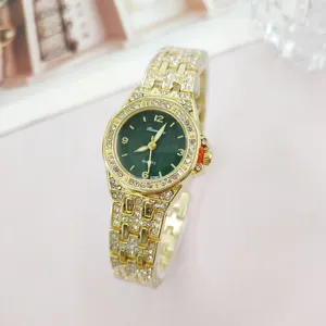 Detailed view of luxury women quartz watch with gold rhinestone strap and green dial.