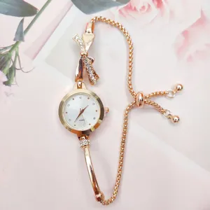 Detail view of the rose gold women quartz watch featuring a sparkling rhinestone bow and dial.