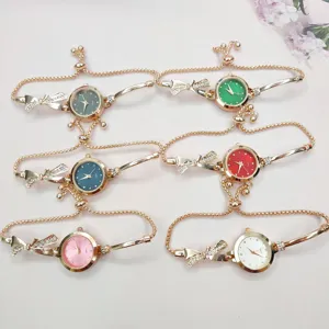 Women quartz bracelet watch with bow rhinestone design, elegant adjustable chain strap.