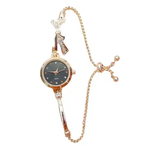 Detailed view of women quartz watch with bow rhinestone and rose gold chain strap design.