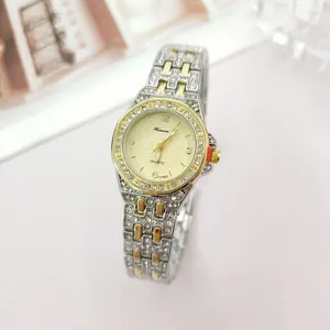 Elegant women quartz watch with two tone steel strap rhinestone bezel detailed dial.