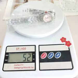 Detailed view of women's rhinestone steel strap quartz watch, sparkling design, weighing 52g.
