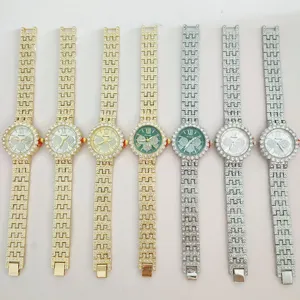 Detailed view of luxury rhinestone women quartz watches with metal strap and bling dials.