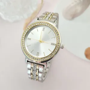 Exquisite rhinestone bezel quartz watch with two-tone steel band for elegant everyday wear.