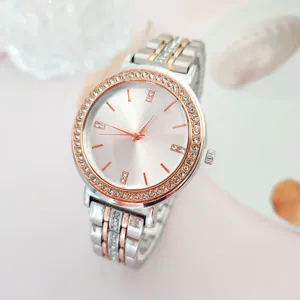 Detail shot of elegant women quartz watch featuring shimmering rhinestones and two-tone strap.