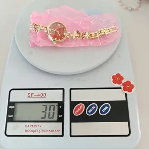 Damen Quarzuhr Goldkette roter Strass Schmetterling Anhänger elegante Damenuhr Armbanduhr