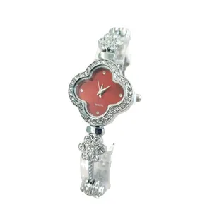 Women quartz watch with clover rhinestone dial and elegant bracelet strap for daily wear style.