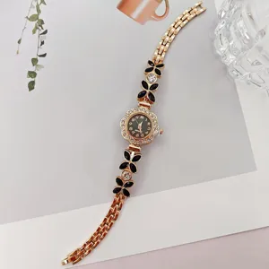 Damen Quarzuhr mit Strass Blumen Gliedern elegante goldene Armbanduhr fuer den Alltag