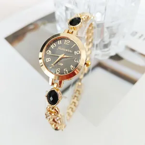 Women quartz bracelet watch gold tone black dial elegant fashion casual wristwatch details.