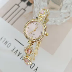 Elegante Damen Quarzuhr mit rosafarbenem Zifferblatt Strasslünette und schickem Armband.