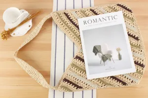 Handmade woven straw shoulder bag with diagonal stripes, casual beach vacation tote for women.