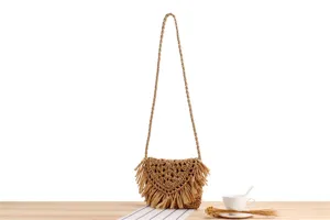 Chic woven straw shoulder bag with fringe detail, perfect for beach holiday and casual daily wear.