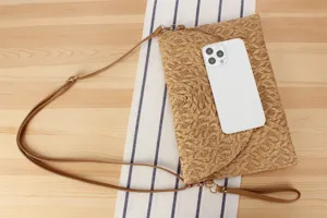 Chic straw woven crossbody bag detail showing fine texture, elegant daily casual style.