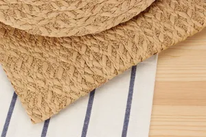 Close-up detail of woven straw handbag texture, casual summer beach clutch daily accessory