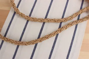 Close-up detail of straw woven bag strap showcasing natural texture and durable design.