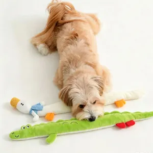 Close-up detail view of cute plush duck and crocodile interactive pet toys with a dog.