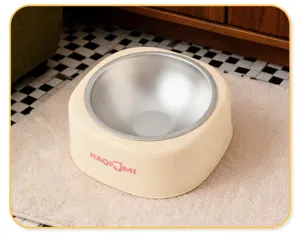 Pet water bowl detail showing stainless steel inner and beige base for anti-wet mouth feeding.