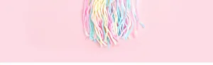 Colorful cat toy hanging strings detail shot, soft pastel colors for pet play and fun.