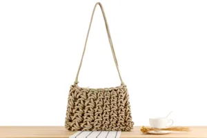 Handmade woven rope knot shoulder bag, chic casual beach vacation design for stylish women.