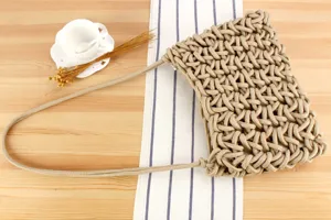 Handcrafted woven rope shoulder bag, minimalist chic style for beach vacation and daily use.